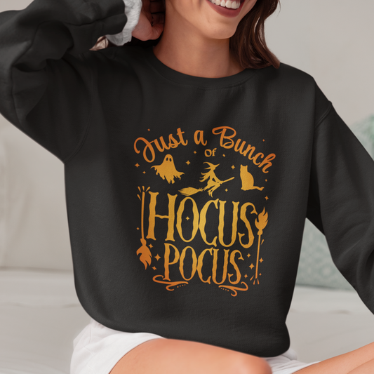 A woman wearing a black sweatshirt with 'Just a Bunch of Hocus Pocus' printed in orange.