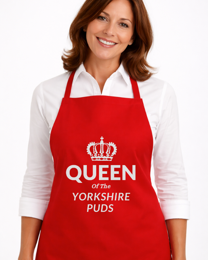 Woman wearing red Queen of the Yorkshire Puds novelty apron – funny cooking apron and baking apron gift for Yorkshire pudding lovers