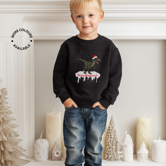 Child wearing a black sweatshirt with a Christmas dinosaur design, standing in a festive room.