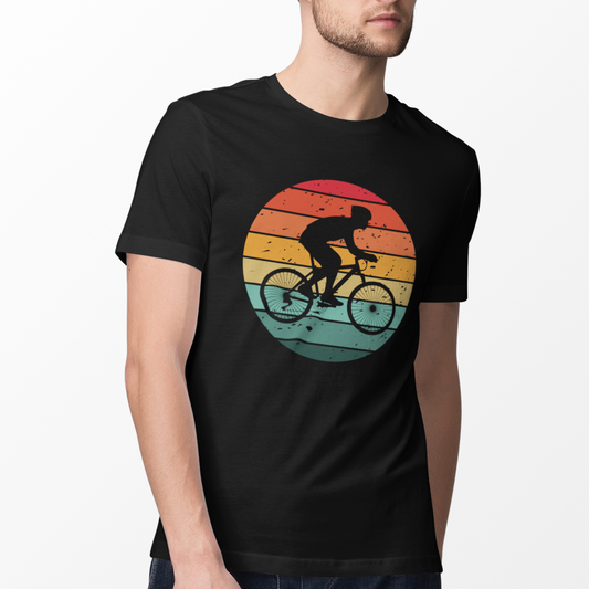 Man wearing a black t-shirt with retro-style cyclist silhouette printed on a sunset gradient background