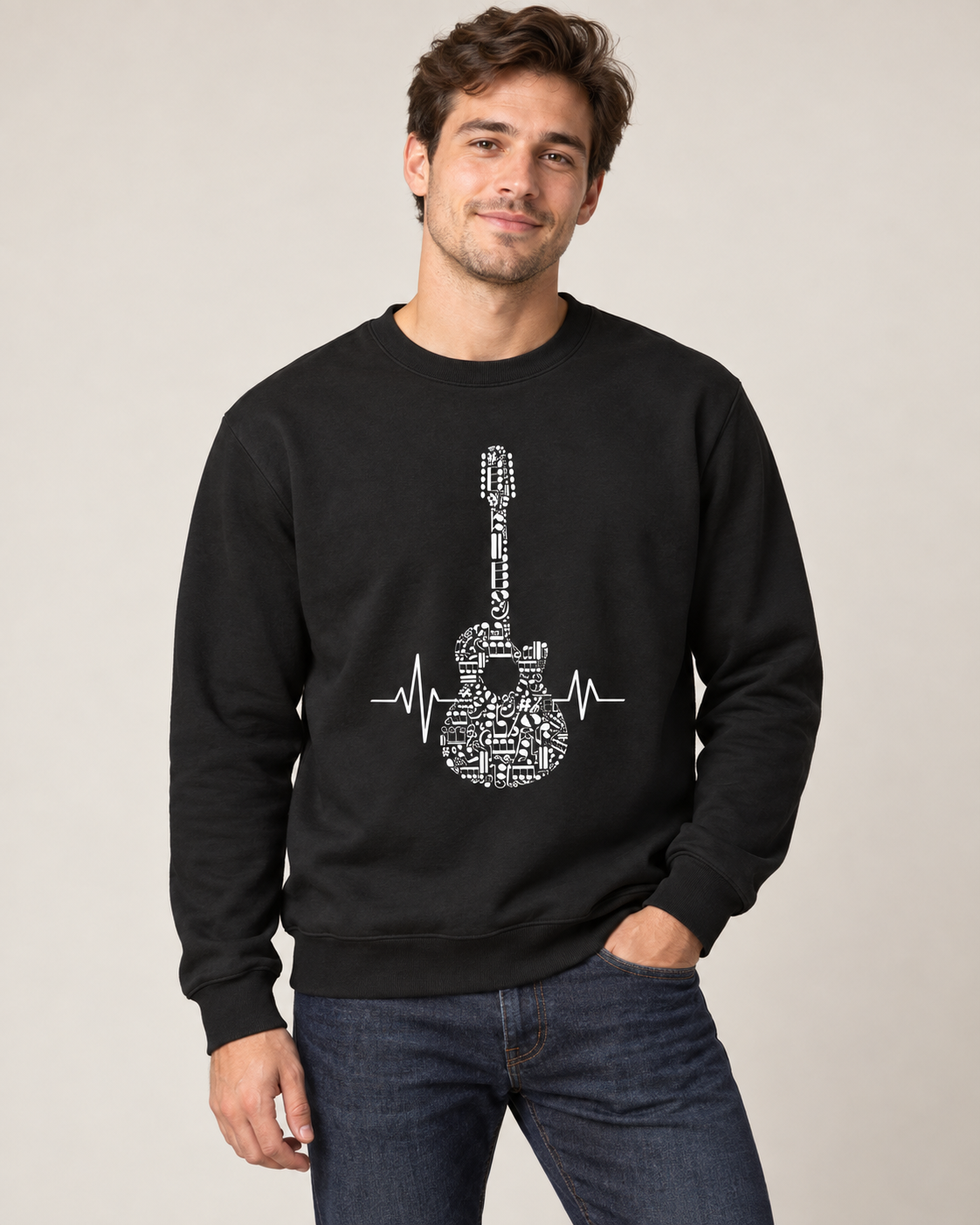 Young man wearing a black sweatshirt featuring a musical-note guitar and heartbeat design.