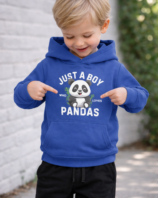 Boy wearing royal blue “Just a Boy Who Loves Pandas” kids hoodie pointing at cute panda graphic outdoors
