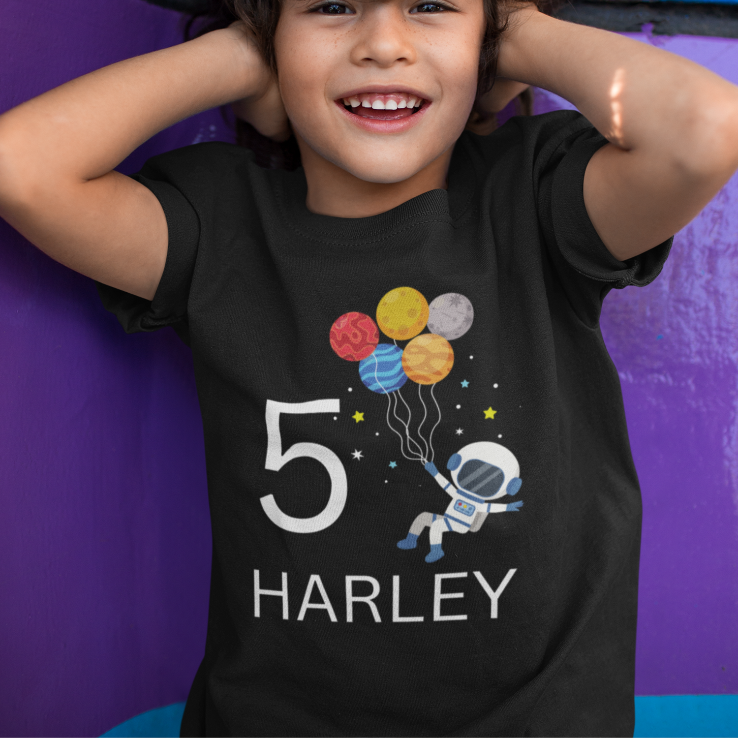 Black t-short with boy's name and age with a spaceman holding balloons graphic