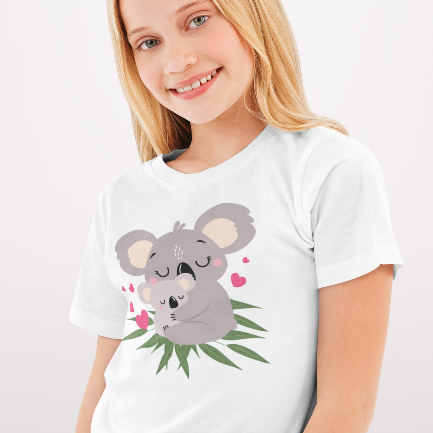 Young girl wearing a white t-shirt with printed Koala design