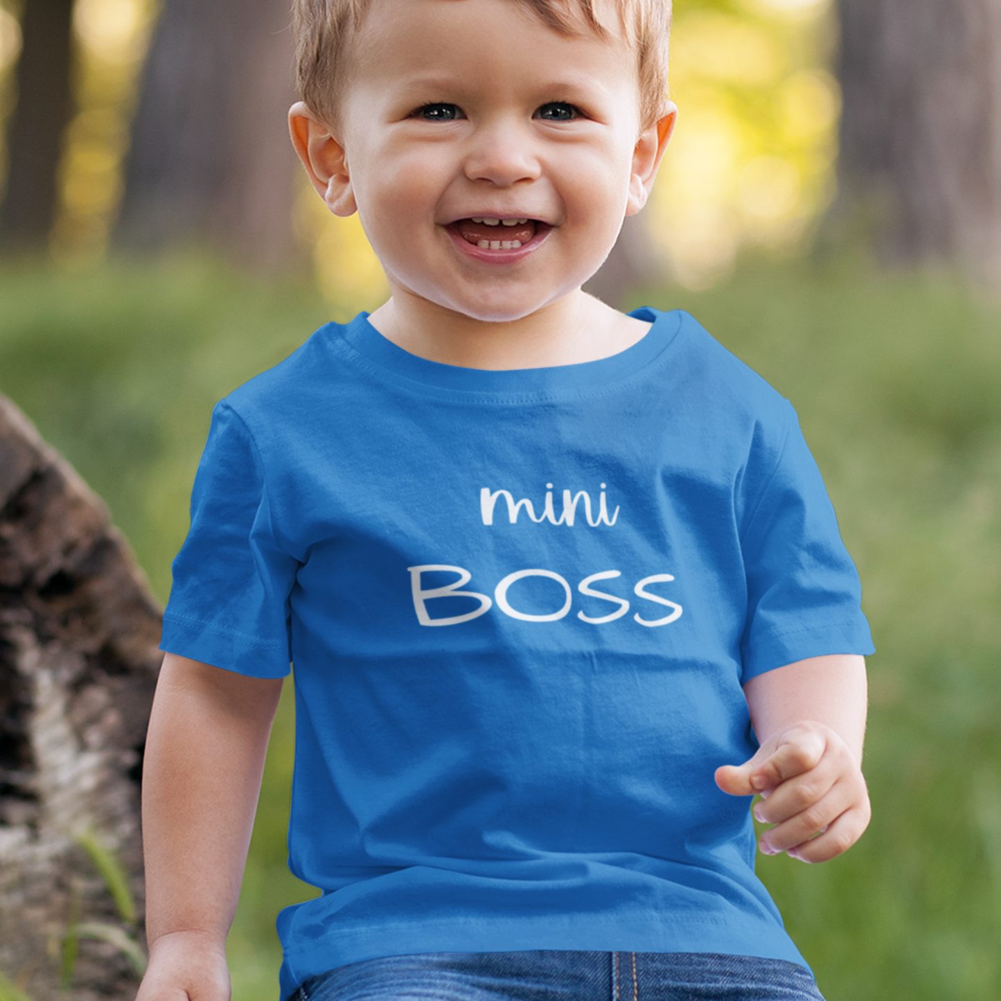 Boy Toddler wears Sapphire Blue premium cotton short sleeved t-shirt with white printed text; Mini BOSS